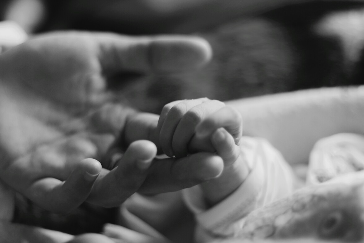 Holding hands with a baby